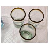 Set of Drinking Glasses Including Blue Striped and Amber-Rimmed Designs