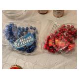 Budweiser and Bud Light Collectible includes a Bud Light glass, two miniature Budweiser bottles, and Bud-themed beaded necklaces in red and blue