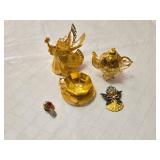 Gold and Silver Decorative Figurines and Jewelry Set including Angel Figurine, Peacock Teapot, and Brooch
