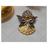 Gold and Silver Decorative Figurines and Jewelry Set including Angel Figurine, Peacock Teapot, and Brooch
