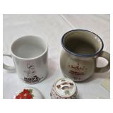 Decorative Collectibles and Mugs Including Minnesota Public Radio Mug, Ceramic Figurine, Embroidered Cloths and a Hand Fan