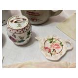 Decorative Collectibles and Mugs Including Minnesota Public Radio Mug, Ceramic Figurine, Embroidered Cloths and a Hand Fan