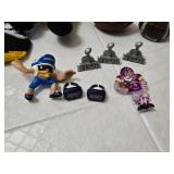 Assorted NFL Memorabilia including Armchair Quarterback Board Game (uncounted), 49ers Plush Toy, and Various Collectible Figurines