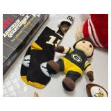 Assorted NFL Memorabilia including Armchair Quarterback Board Game (uncounted), 49ers Plush Toy, and Various Collectible Figurines