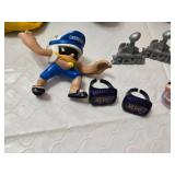 Assorted NFL Memorabilia including Armchair Quarterback Board Game (uncounted), 49ers Plush Toy, and Various Collectible Figurines