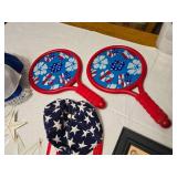 Patriotic Decor and Toy Lot Including Metal Stars, Dolls, and Paddle Games