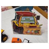 Toy Construction Vehicles and Accessories Lot including CAT Dump Truck, Orange Rescue Vehicle, and Big Bulldozer Book