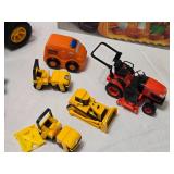 Toy Construction Vehicles and Accessories Lot including CAT Dump Truck, Orange Rescue Vehicle, and Big Bulldozer Book