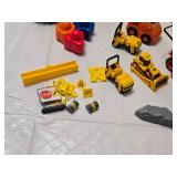 Toy Construction Vehicles and Accessories Lot including CAT Dump Truck, Orange Rescue Vehicle, and Big Bulldozer Book