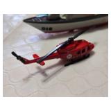 Assorted Toy Vehicles and Figure Set including Motorbike, Helicopter, Plane, Boat, USPS Van, and Red Yamaha Figure