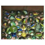 Box of Assorted Glass Marbles including Swirl Designs, Solid Colors, and Cat