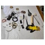Assorted Kitchen and Household Items including Kitchen Tools, Extension Cords, and Gloves