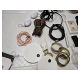 Assorted Kitchen and Household Items including Kitchen Tools, Extension Cords, and Gloves