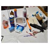 Various Cleaning and Household Items, Including UltraLuxe Detergent and Brushes