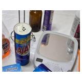 Various Cleaning and Household Items, Including UltraLuxe Detergent and Brushes