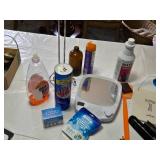Various Cleaning and Household Items, Including UltraLuxe Detergent and Brushes