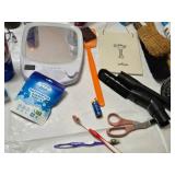Various Cleaning and Household Items, Including UltraLuxe Detergent and Brushes
