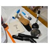 Various Cleaning and Household Items, Including UltraLuxe Detergent and Brushes