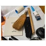 Various Cleaning and Household Items, Including UltraLuxe Detergent and Brushes