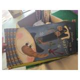 Box of Christmas Decorations including Welcome and Noel Signs, Snowman Themed Decorations, and Festive Flags