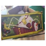 Box of Christmas Decorations including Welcome and Noel Signs, Snowman Themed Decorations, and Festive Flags