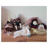 (4) Santa Head Ornaments, (1) Snowman Door Know Hanger, (1) Santa in a Chair Figure