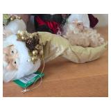 (4) Santa Head Ornaments, (1) Snowman Door Know Hanger, (1) Santa in a Chair Figure