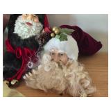 (4) Santa Head Ornaments, (1) Snowman Door Know Hanger, (1) Santa in a Chair Figure
