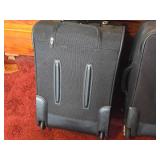 Lot of (2) Ricardo Rolling Suitcases
