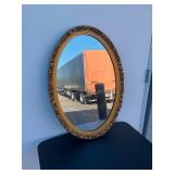 Oval mirror with gold frame
