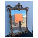 Ornate gold framed mirror