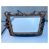 Ornate gold framed mirror