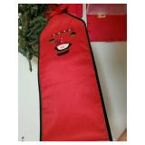 Various Christmas items, tree with lights, Teddy bear, runner and more