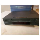 ProScan VCR and box of Various VHS tapes