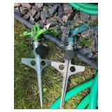 2 Garden Hoses with sprayers and 2 sprinklers