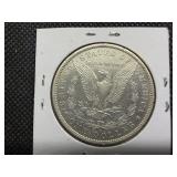 1882 O/S Silver Morgan Dollar Marked AU when Purchased - Greysheet Wholesale Value for an AU50 is $107