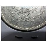 1882 O/S Silver Morgan Dollar Marked AU when Purchased - Greysheet Wholesale Value for an AU50 is $107