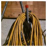 Lot of Extension Cords and Yellow Cage Work Lights