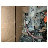This box contains a variety of mixed garage and shop tools, including a red plastic case and a staple gun.