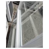 (2)  Vector brand white vinyl single-hung window featuring a prominent blue logo sticker on the glass.