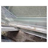 (2)  Vector brand white vinyl single-hung window featuring a prominent blue logo sticker on the glass.