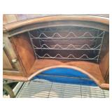 This French country-style bar console features a rich wood top and a decorative wrought iron frame