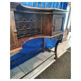 This French country-style bar console features a rich wood top and a decorative wrought iron frame