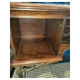 This French country-style bar console features a rich wood top and a decorative wrought iron frame