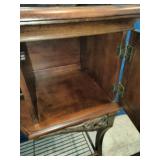 This French country-style bar console features a rich wood top and a decorative wrought iron frame