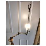 Vintage brass floor lamp appears to be a Underwriters Laboratories swing arm model featuring an ornate stem design