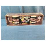 2005 NASCAR "Flat-Out" Mug Set featuring colorful stock car graphics and includes two coffee mugs.