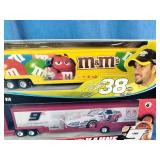 Winners Circle 1:64 scale NASCAR die-cast trailer rigs featuring the #38 M&M