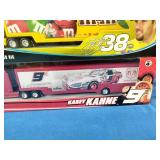 Winners Circle 1:64 scale NASCAR die-cast trailer rigs featuring the #38 M&M