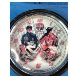 This vintage Coca-Cola NASCAR Dale Earnhardt Sr. and Jr. wall clock features signature branding and a glass lens.